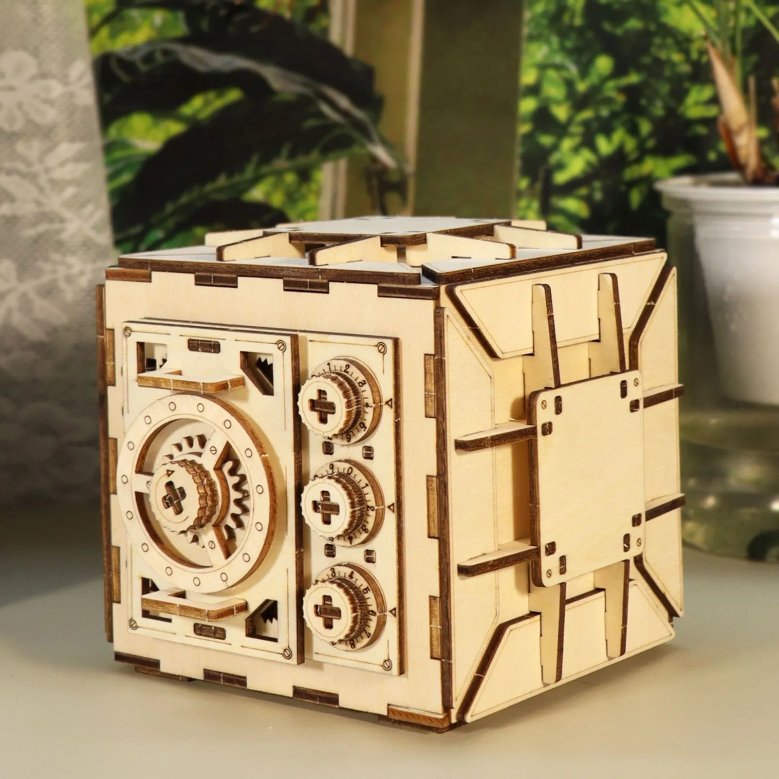 A finished wooden puzzle box with number dials